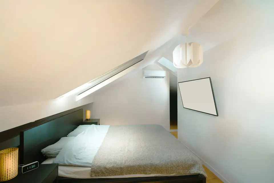 Bedroom under the eaves | Fitted wardrobes Newcastle Bedroom under the eaves with a sloping ceiling and soft natural light, a fitted wardrobe idea for Newcastle homes