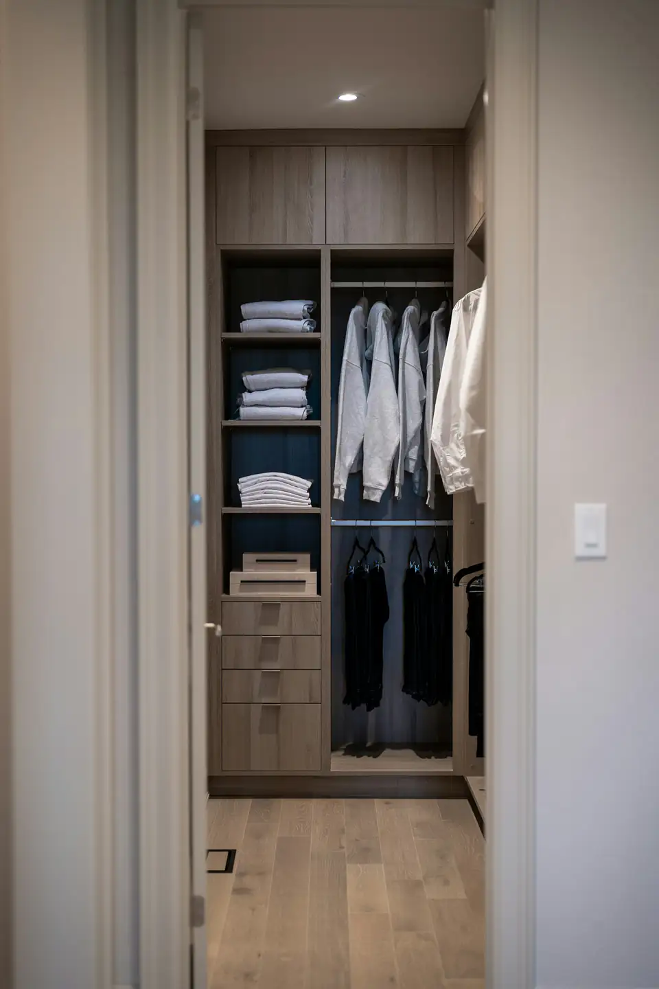 Fitted wardrobe interior with shelving for folded clothes and a hanging rail, a fitted wardrobe idea for Newcastle homes